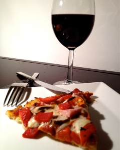 Awesome way to end the week: A glass of Merlot to accompany the best gluten free pizza I've ever had.